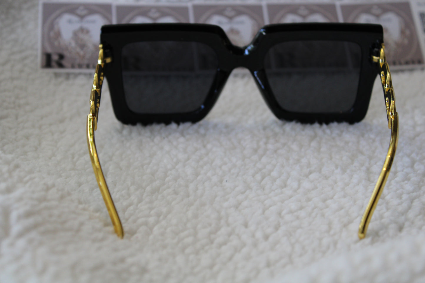 Sunglasses black gold color on side